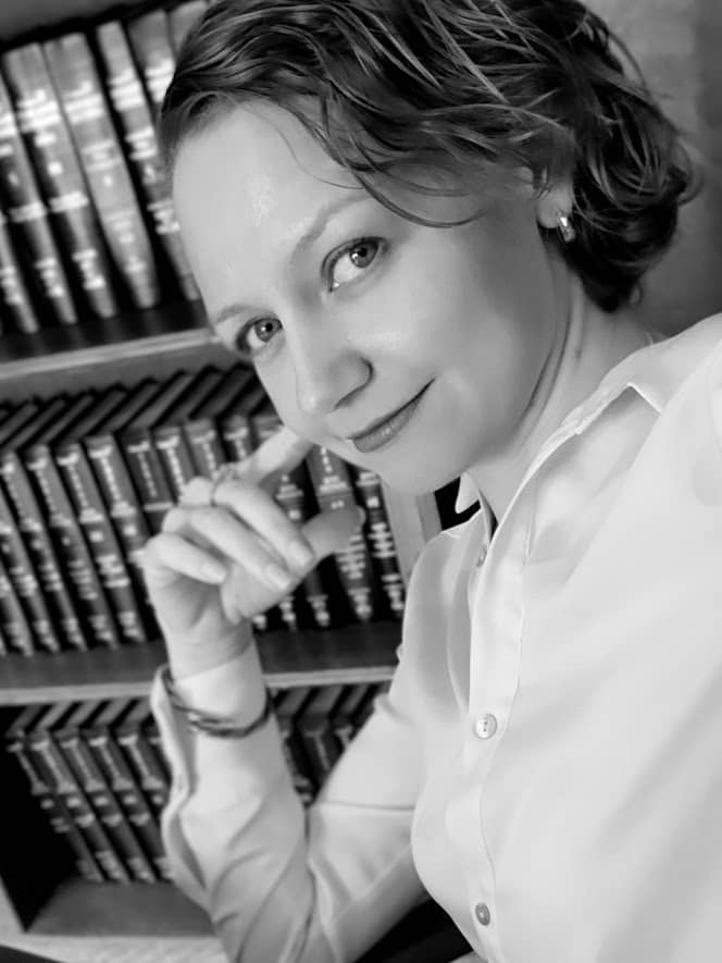 Felicia M. L. Davis photo black and white with bookshelf in background